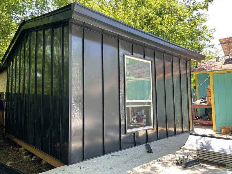 Black standing seam metal wall panels for Roof Inspection in Tustin