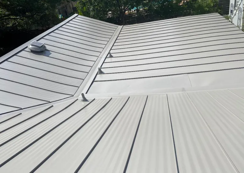 Solar attic fan installed on a metal roof for Roof Ventilation in Tustin